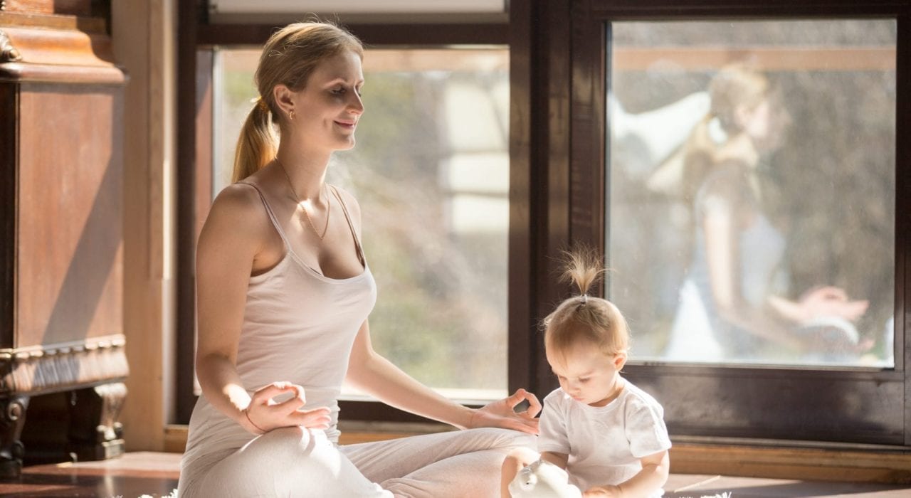 Tips for new mums - Mum doing yoga with baby. Practicing self-care. Tips for new mums