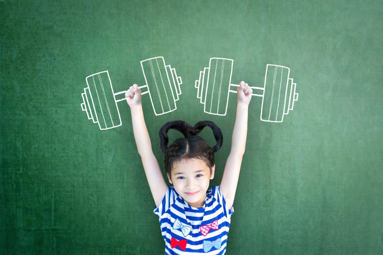 Little girl showing strength