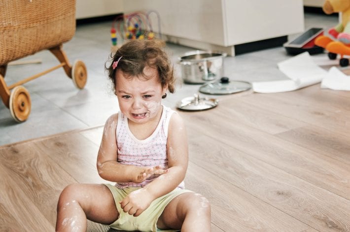 Toddler having tantrum on the floor