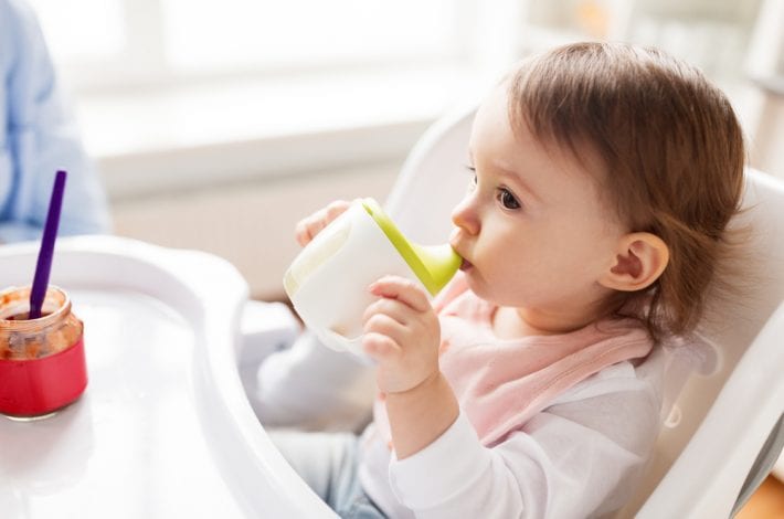 baby drinking from chilled sippy cup