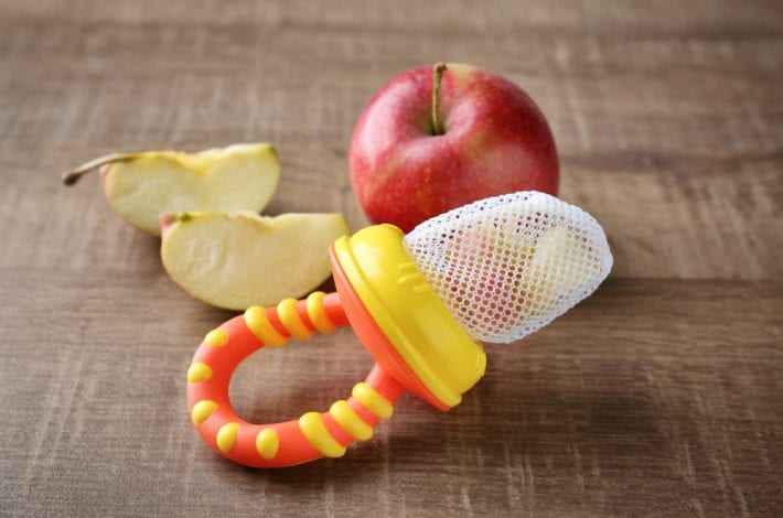 baby teething mesh nibbler with apple chunks