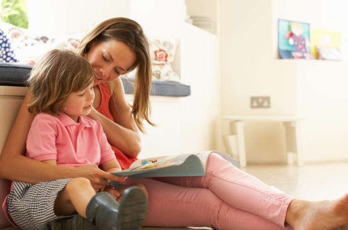 mother reading child a book