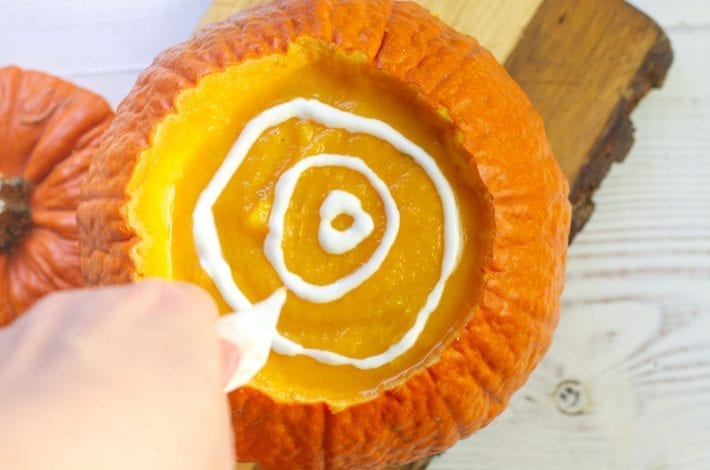 Make this classic squash and pumpkin soup this Halloween - creamy pumpkin soup with rosemary and served in pumpkin shells