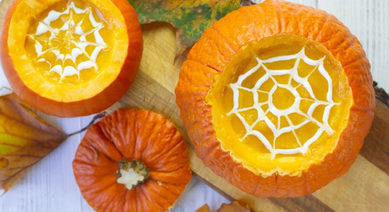 Make this classic squash and pumpkin soup this Halloween - creamy pumpkin soup with rosemary and served in pumpkin shells