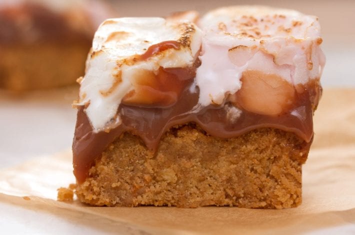 Baked smores bars with an oat base - make these gooey dessert bars for a bonfire night treat