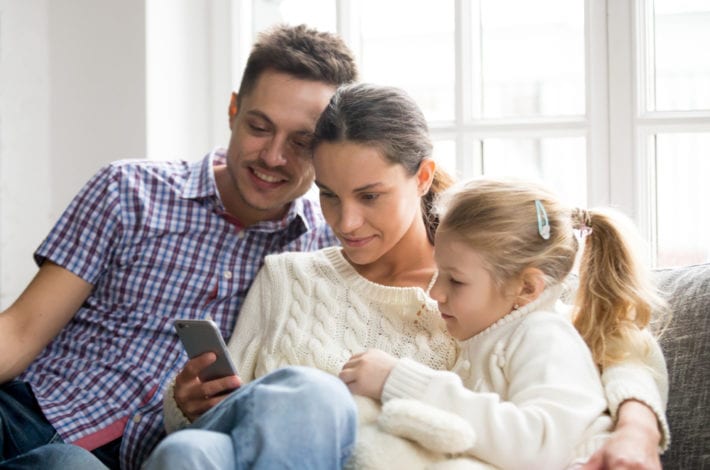 child safe online - parent checking childs mobile apps