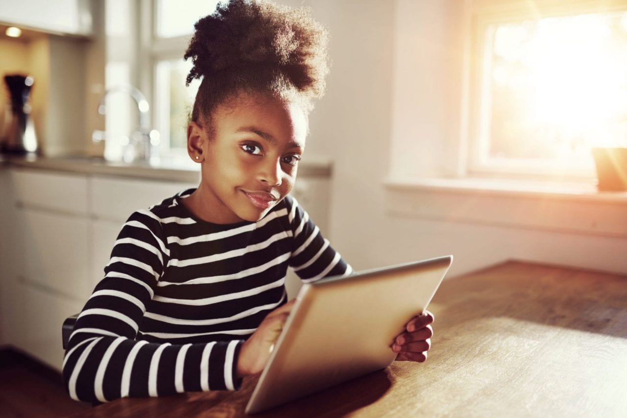 child safe online - young girl surfing the internet