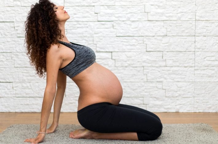 exercising during pregnancy - tips for staying safe - woman exercising at home