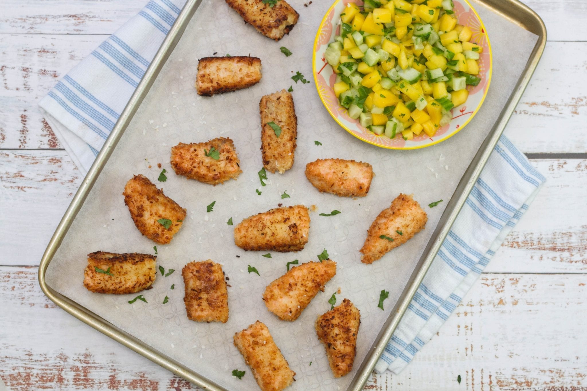 Coconut salmon goujons with mango salsa