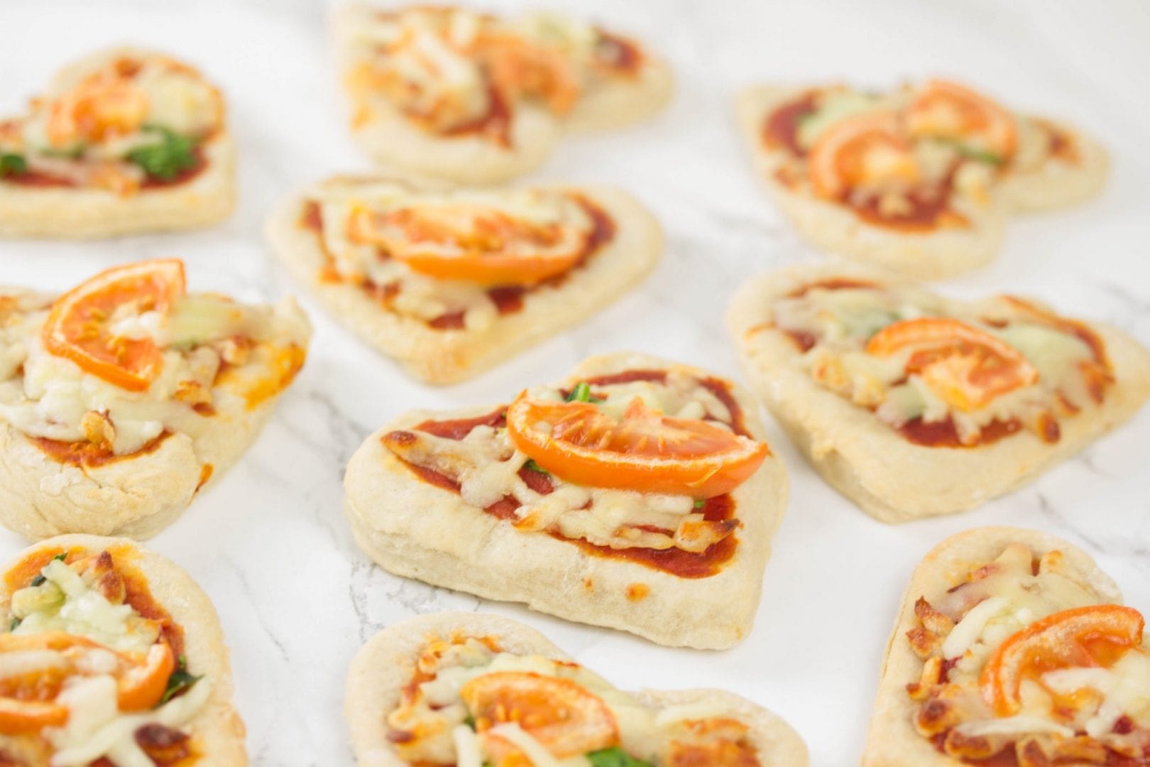 Pizza hearts - try this fun Valentines recipe for kids with these mini pizzas