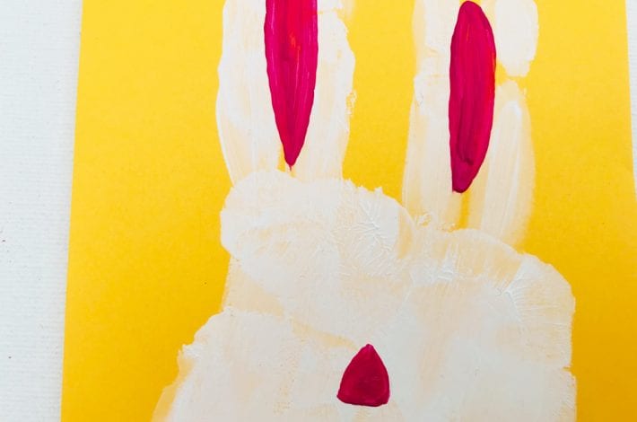 Easter handprint craft - make these cute little hand print Easter bunnies with this fun toddler craft