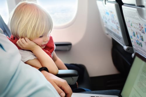 how to make travelling with toddlers on a plane easy - 12 tips to help you travel with kids