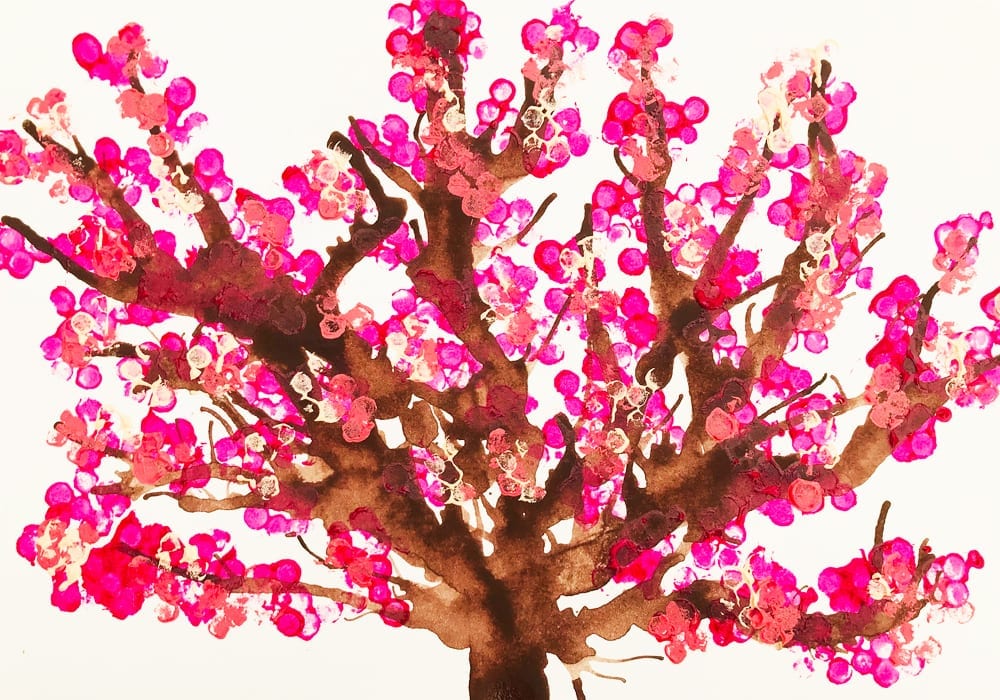 Cotton bud tree art. Make these blow paint and cotton bud printed cherry tree paintings - a great spring craft for kids