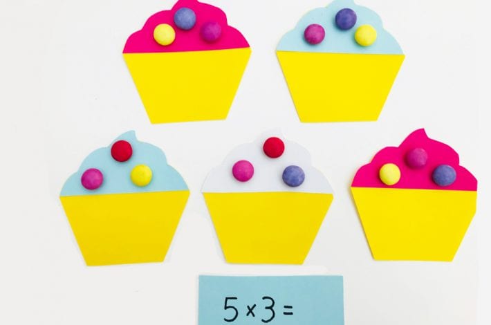 Have fun with times tables by playing this super fun (and yummy) cupcake game with your kids - a great game to teach those first times tables - learning fun for kids
