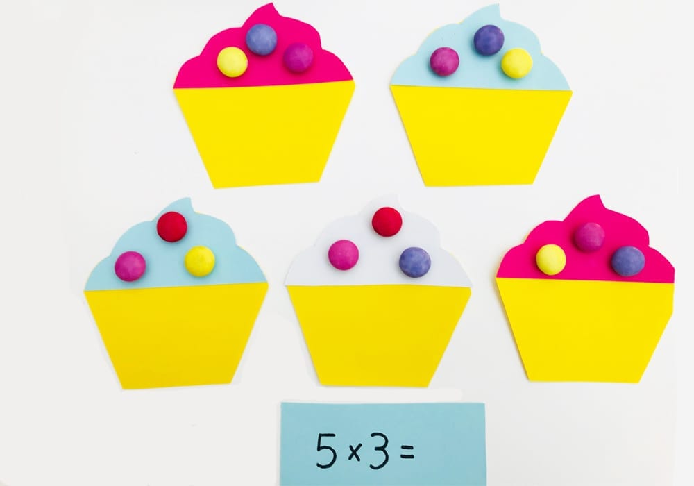 Have fun with times tables by playing this super fun (and yummy) cupcake game with your kids - a great game to teach those first times tables - learning fun for kids