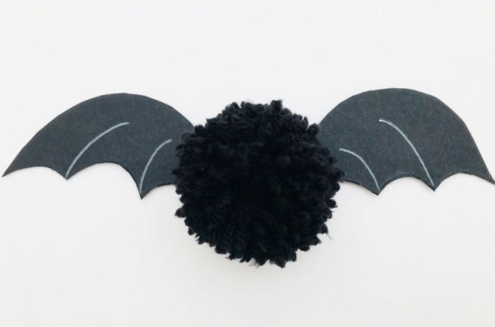 Make these awesome Halloween pom pom bats this October - a great craft for little kids that also make spooky homemade Halloween decorations