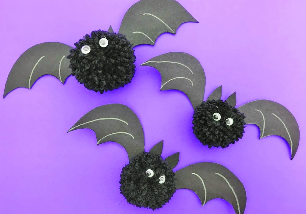 Make these awesome Halloween pom pom bats this October - a great craft for little kids that also make spooky homemade Halloween decorations