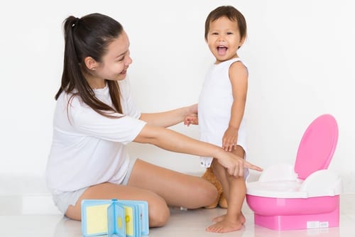Is your toddler afraid to poop on the potty or loo - if so read on for 10 top tactics to help