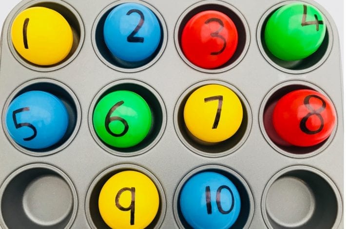 Make a fun number recognition game with these colourful balls. Fish out each number and match it to the right number of dots in the muffin tray.