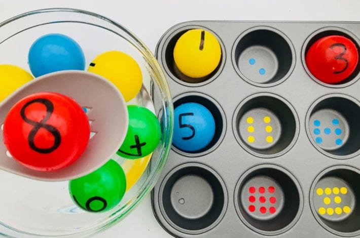 Make a fun number recognition game with these colourful balls. Fish out each number and match it to the right number of dots in the muffin tray.