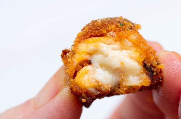 Chicken Parmesan bites - cheesy chicken pieces stuffed with mozzarella and cooked in marinara sauce - great for family dinners and kids meals