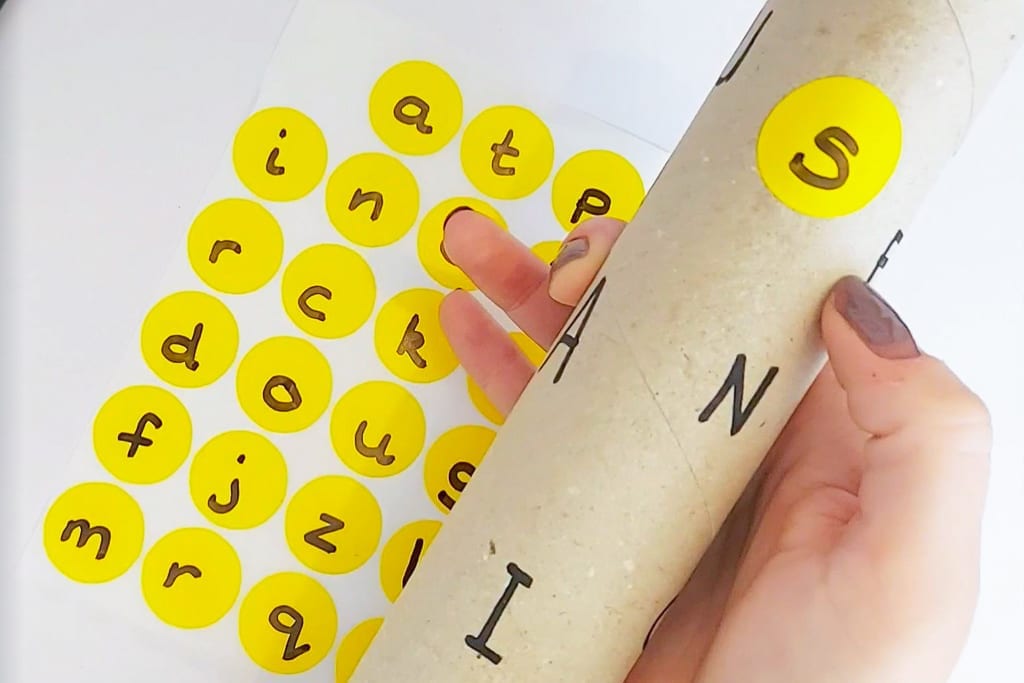 Letter matching activity - match lower case to upper case letters using cardboard rolls - easy learning activity for early years